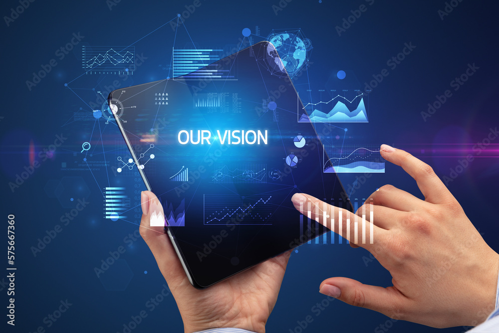 Businessman holding a foldable smartphone, business concept Businessman holding a foldable smartphone, business concept