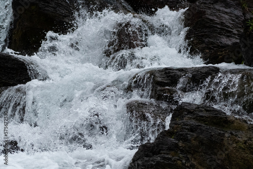 Fototapeta Naklejka Na Ścianę i Meble -  Water Rushes Over Rocks
