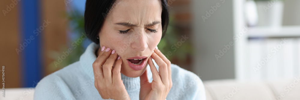 Young woman with severe acute toothache closeup Young woman with severe acute toothache closeup
