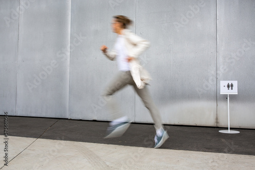Принти на полотні Woman rushing to a bathroom, toilet, hygiene, restroom