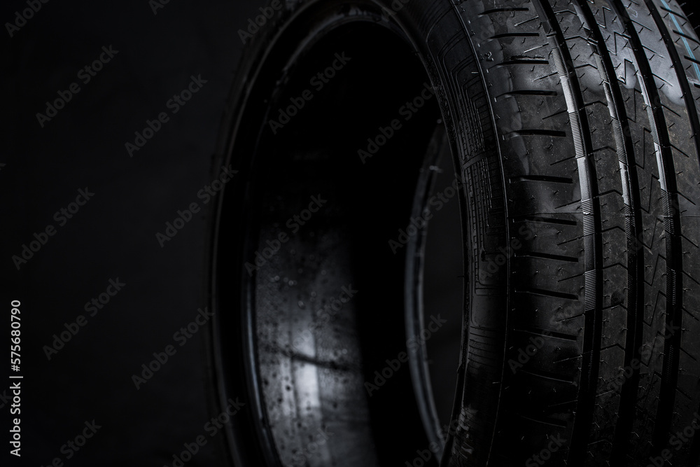 Stack of brand new high performance car tires on clean high-key white studio background Stack of brand new high performance car tires on clean high-key white studio background