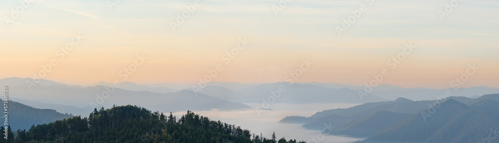 Dawn in the mountains. Amazing mountain scenery. Panoramic photo