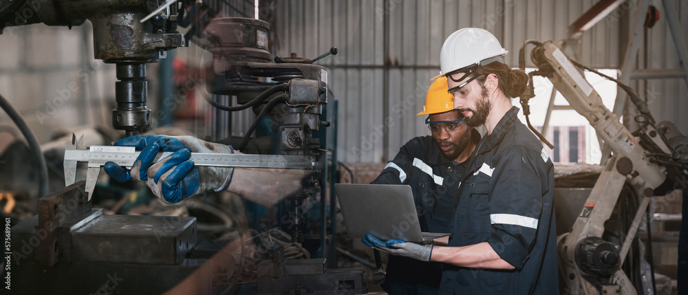 Industrial engineers inspect and perform maintenance on the machines at factory machines. Worker checking and repair machine. Industrial engineers inspect and perform maintenance on the machines at factory machines. Worker checking and repair machine.