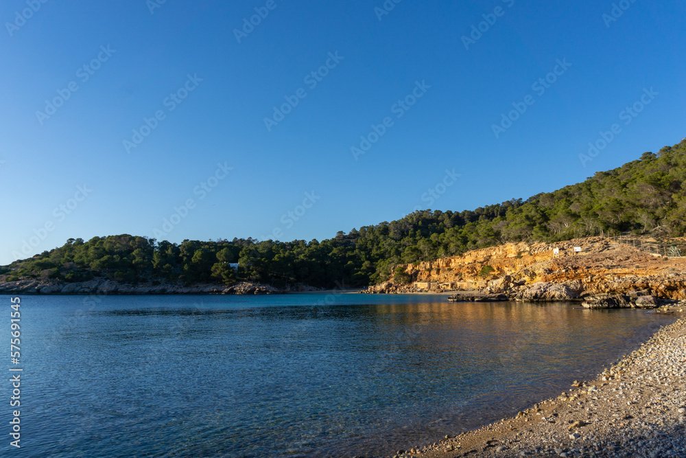 Cala Salada, on the island of Ibiza, with the turquoise beach, without people on a sunny day.