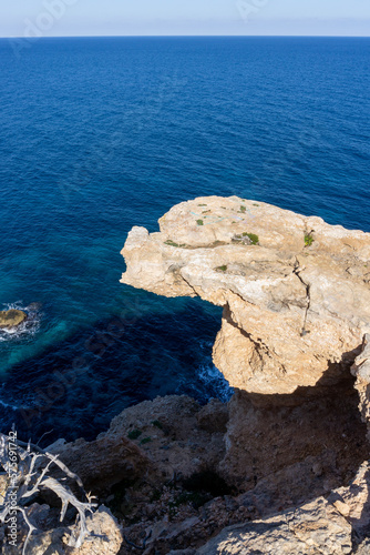 Views from a cliff to the sea, in the island of Ibiza on a sunny day.