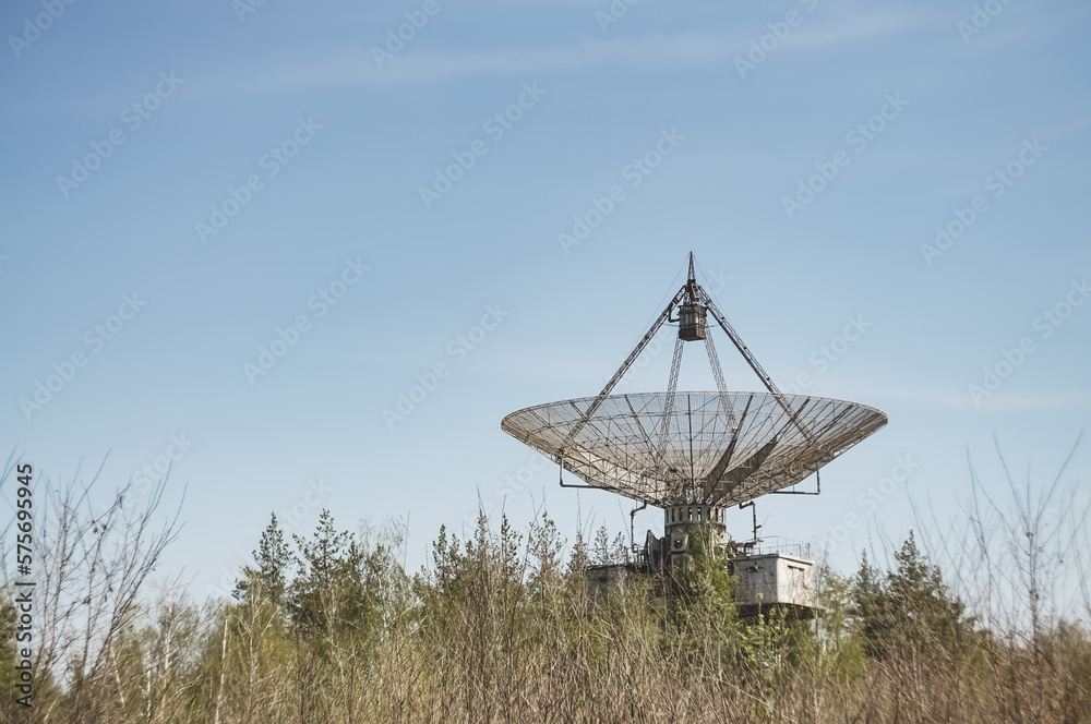 The metal structure of the astronomical radio telescope observatory on the territory of the Institute of the Ionosphere in the Kharkov region, on a spring sunny day