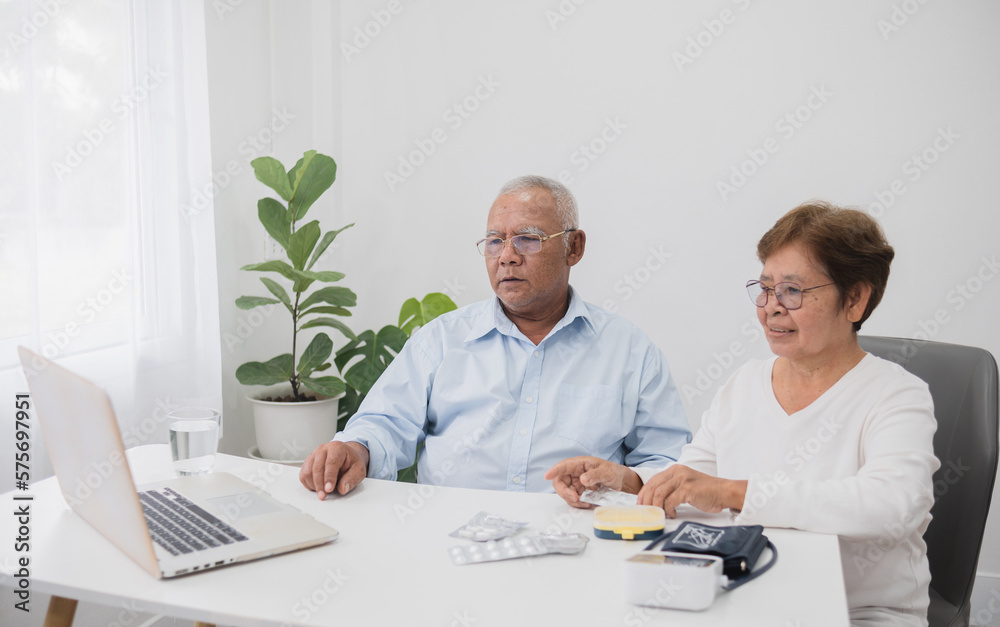 telemedicine concept, Asian senior couple, using laptop video conference with doctor. telemedicine concept, Asian senior couple, using laptop video conference with doctor.
