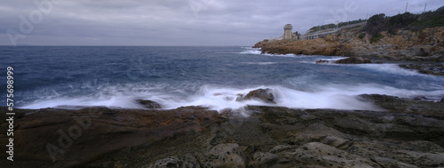 Tuscan coast washed by the waves of the stormy sea