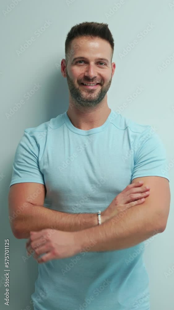 Portrait of happy casual man pointing at blank space, Young guy standing at white wall, Isolated on white background, copy space. Portrait of happy casual man pointing at blank space, Young guy standing at white wall, Isolated on white background, copy space.