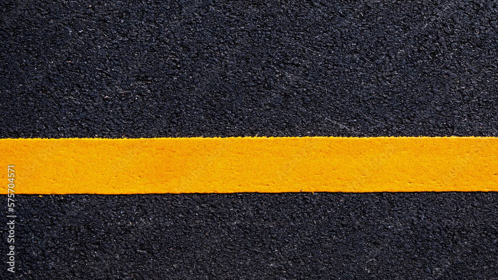 Yellow line on new asphalt detail, Street with yellow line texture