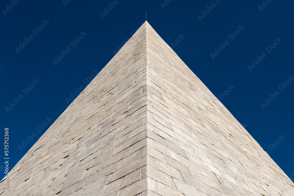 White marble Pyramid of Cestius, now part of Rome ancient walls, erected in the 1st century BC White marble Pyramid of Cestius, now part of Rome ancient walls, erected in the 1st century BC