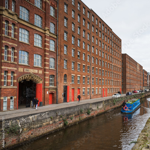 Blue boat passes Royal Mill photo