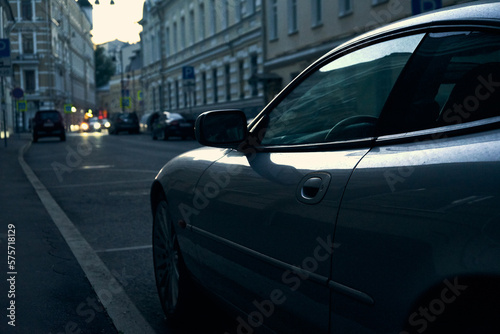Сlose-up of a sports car in a blue light on a Moscow street