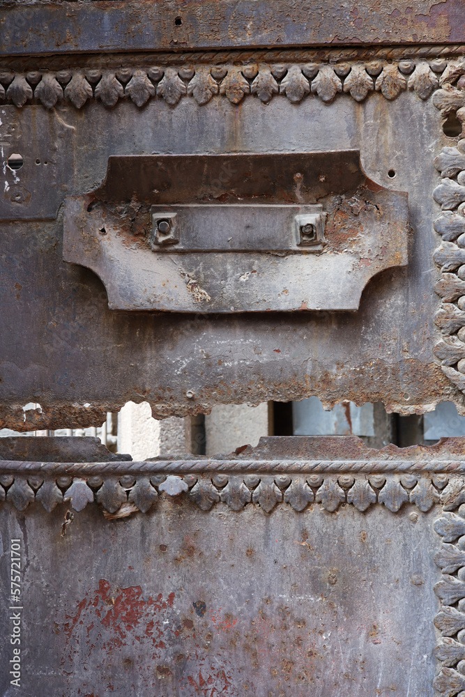 close-up detail of an old rusty metal door