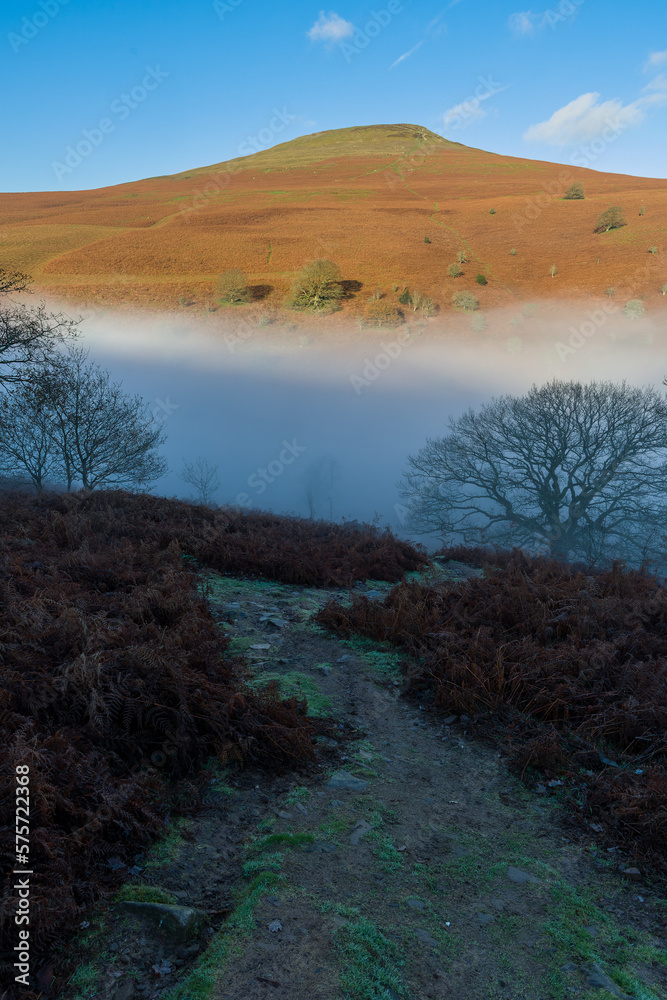 Mountains climbing above a sea of fog and cloud (Sugar Loaf, Brecon Beacons, Wales) Mountains climbing above a sea of fog and cloud (Sugar Loaf, Brecon Beacons, Wales)