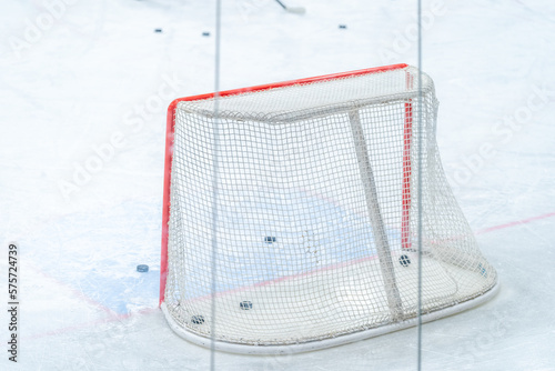 Photography ice hockey goal with pucks, during a hockey players training session