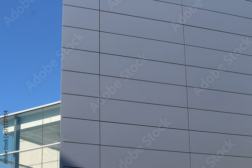 Abstract image of the corner of a new metallic cladded building