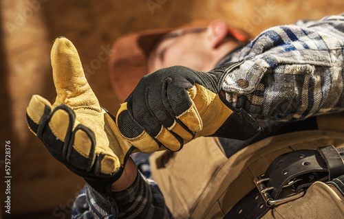 Professional Contractor Putting on Construction Gloves photo