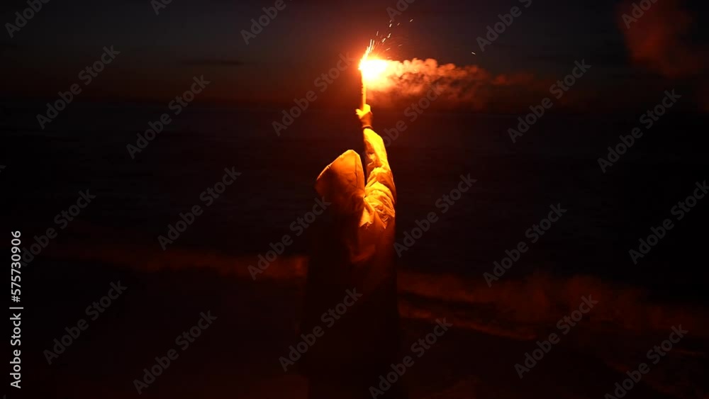 a lonely traveler in distress, shipwreck victim signal light at night help signal ocean at night