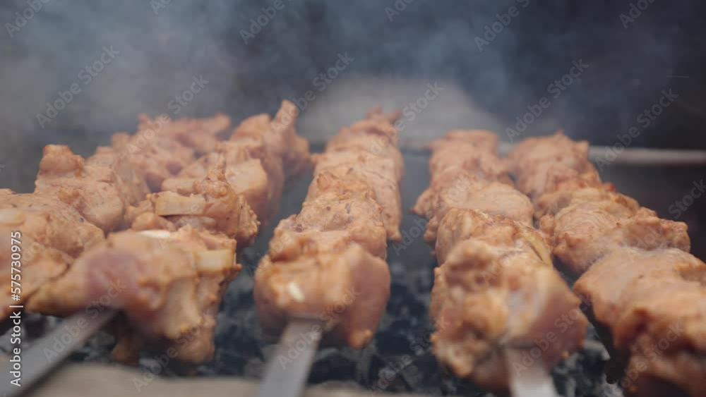 Delicious juicy shish kebab. pork on fire. food on fire. barbecue in the yard. Georgian kebab. meat hot tasty dish. fried meat, juicy pork. cooking on a campfire. Georgian cuisine. meat on a skewer Delicious juicy shish kebab. pork on fire. food on fire. barbecue in the yard. Georgian kebab. meat hot tasty dish. fried meat, juicy pork. cooking on a campfire. Georgian cuisine. meat on a skewer