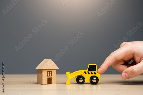Canvas-taulu Men pushing gives the order to the bulldozer to demolish the house