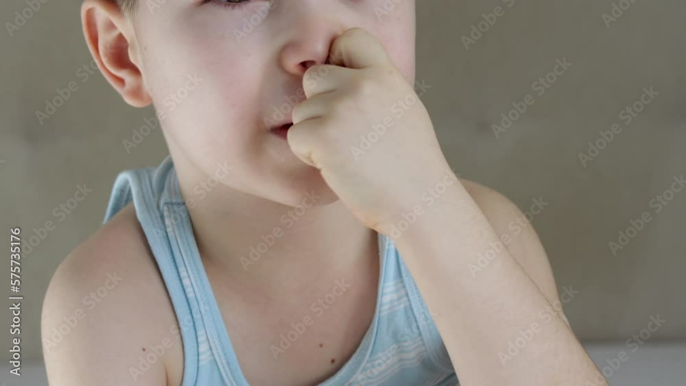 kid lies lying on bed rubbing eyes sleepy child smiling.preschooler boy with finger in nose bad habits.child cover eyes with hands tired adorable baby.day time falling asleep close up face portrait 4k kid lies lying on bed rubbing eyes sleepy child smiling.preschooler boy with finger in nose bad habits.child cover eyes with hands tired adorable baby.day time falling asleep close up face portrait 4k