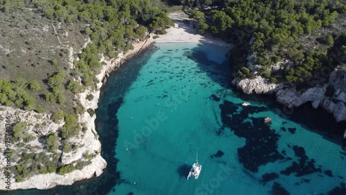 Calas Macarella y Macarelleta ubicadas en el sur de Menorca, Islas Baleares, es probablemente una de las playas mas bonitas de España, que destaca por su agua transparente de color turquesa. photo