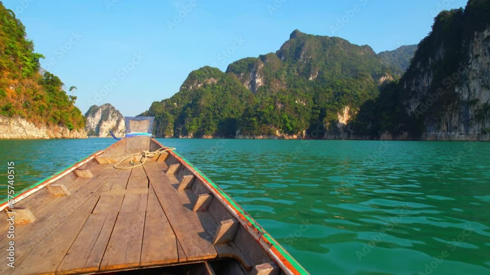 Hop on a long-tail boat tour to witness the majestic limestone mountains, crystal-clear emerald water, and serene lake. (Ratchaprapha Dam, Khao Sok National Park, Surat Thani Province, Thailand).
Hop on a long-tail boat tour to witness the majestic limestone mountains, crystal-clear emerald water, and serene lake. (Ratchaprapha Dam, Khao Sok National Park, Surat Thani Province, Thailand).