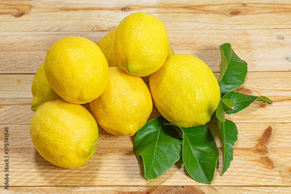 Fresh and healthy lemons on a wooden table
