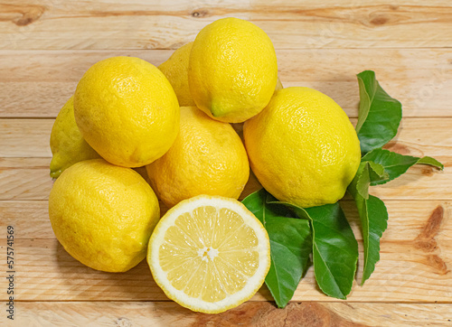 Fresh and healthy lemons on a wooden table