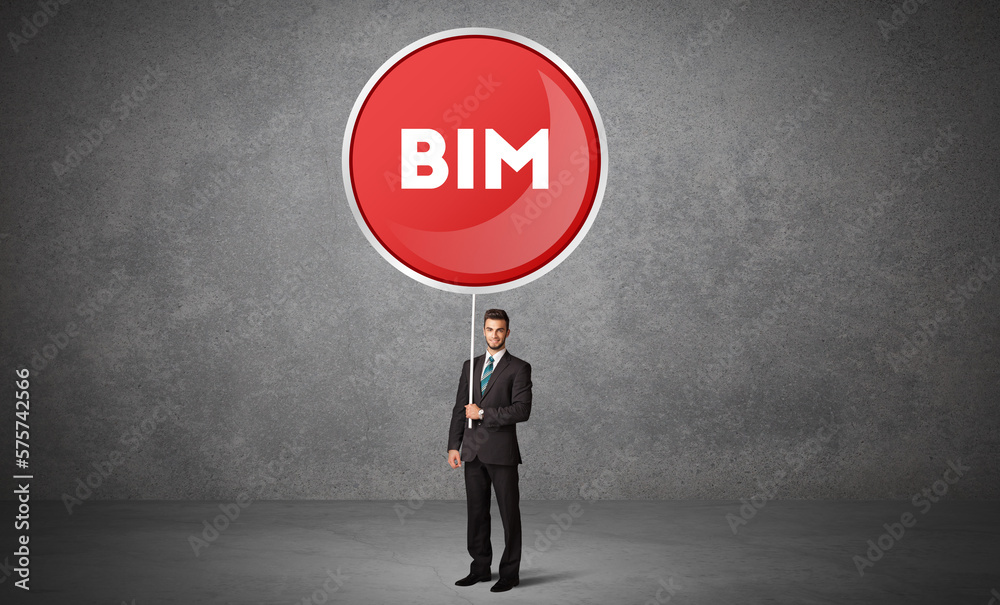 Fototapeta premium Young business person holdig traffic sign