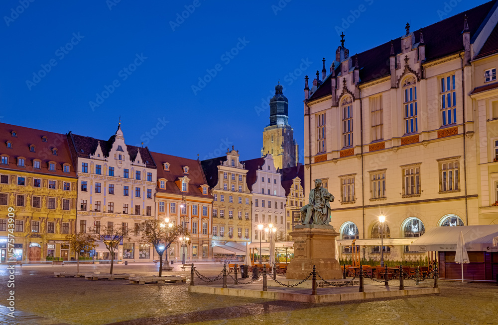 Market square in Wroclaw with colorful buildings, new town hall and statue of Alexander Fredro