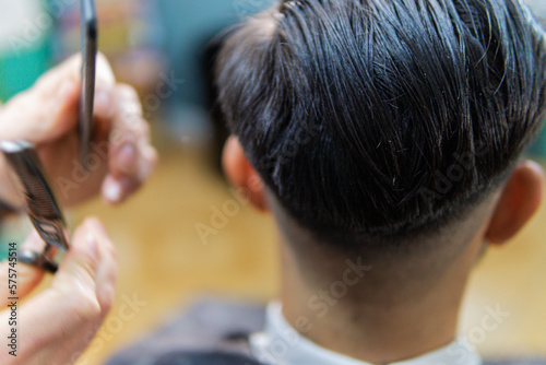 Styling straight men's hair in barber shop