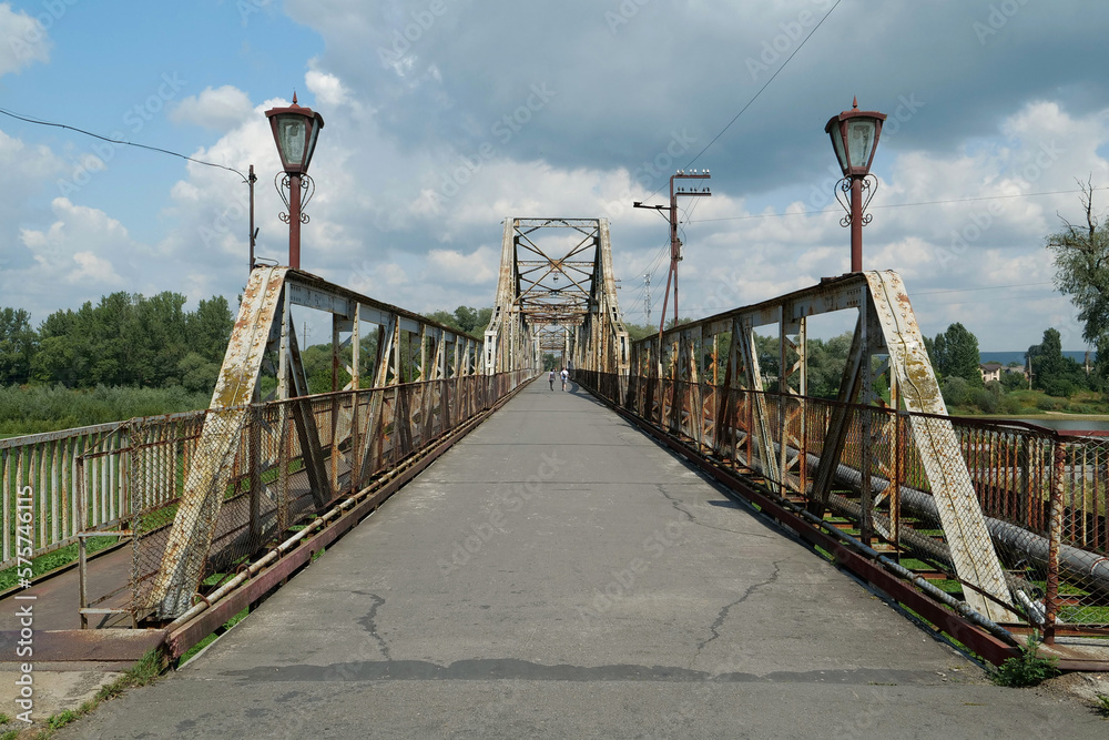 Old metal bridge across Dniester river in the city of Halych, western Ukraine Old metal bridge across Dniester river in the city of Halych, western Ukraine