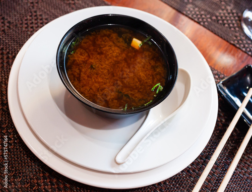 Traditional Japanese miso soup consisting of stock dashi with softened miso paste and vegetables