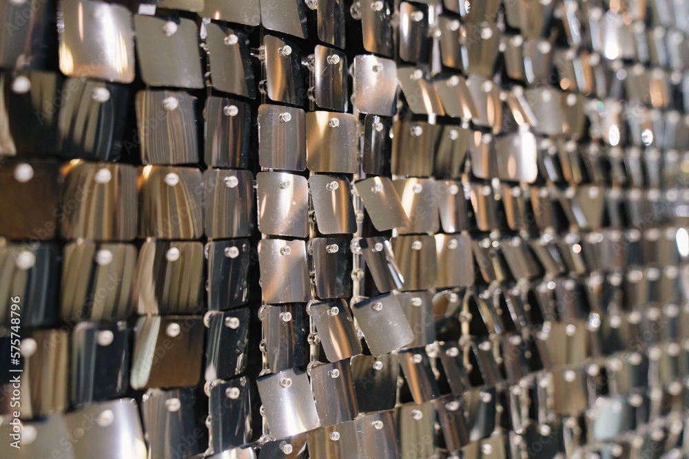 Fototapeta premium wall with sequins. iridescent and shiny plates as a decor. 