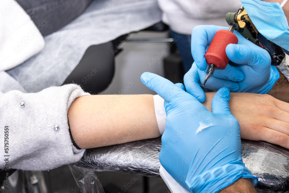 The Perfect Canvas: A Close-up of a Tattoo Artist's Work on the Wrist The Perfect Canvas: A Close-up of a Tattoo Artist's Work on the Wrist