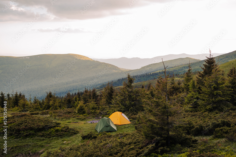 camping in mountains , rest in tent