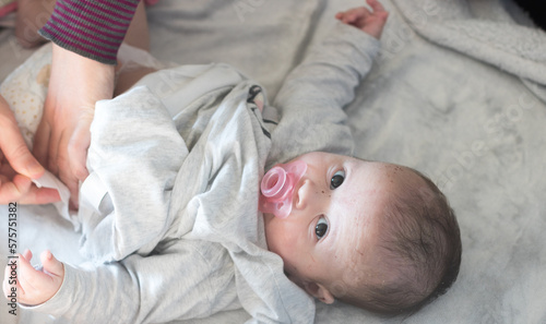 Newborn baby during diaper change