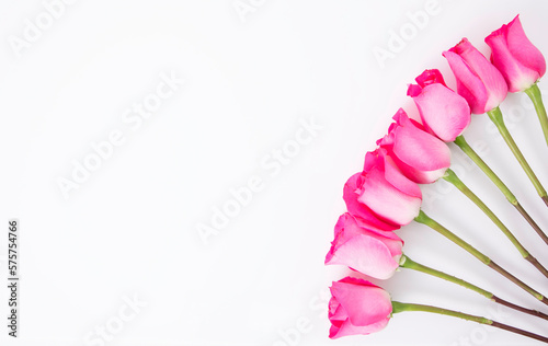 White background with beautiful pink flowers in the corner, perfect for invitation or greeting cards