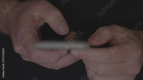 Doom scrolling. Finger of bored man scrolls page app on mobile phone. Browsing internet or social network. Compulsive scrolling concept. Front view