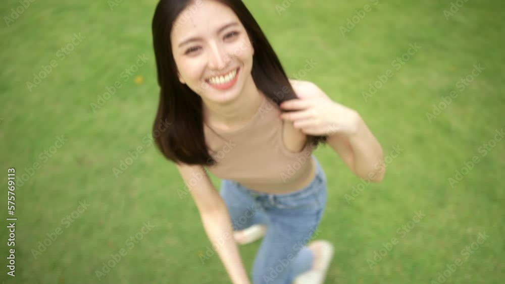 Candid Happy feeling of Beautiful Young Woman smiling outdoor in sunlight. Pretty face of female and beautiful smile. Candid Happy feeling of Beautiful Young Woman smiling outdoor in sunlight. Pretty face of female and beautiful smile.