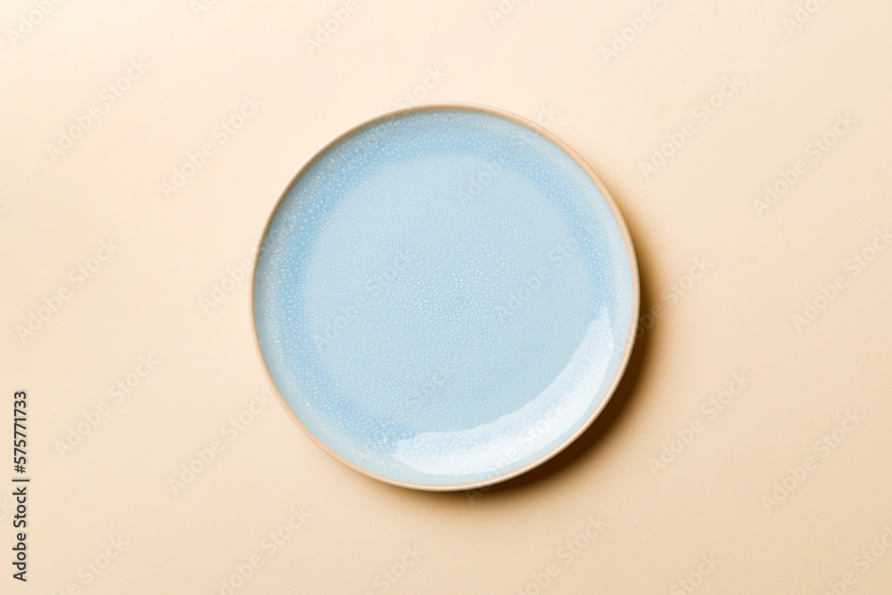 Top view of isolated of colored background empty round blue plate for food. Empty dish with space for your design Top view of isolated of colored background empty round blue plate for food. Empty dish with space for your design
