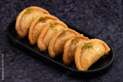 Gujia Also Called Gujiya, Pirukiya, Pirukia, Pedakiya, Karanji, Basundi Or Gughra Stuffed With Mawa, Khoya, Chasni, Mava, Khoa - Indian Sweet Dumpling Enjoyed On Deepawali, Teez, Holi, Diwali And Teej