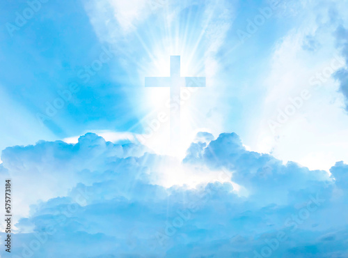 Christian cross with god ray on blue sky background
