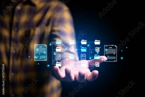 business man holding virtual files and folders diagram , manage digital files document with Global Internet connection. Business global internet connection application technology