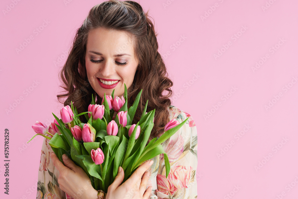 happy woman in floral dress on pink happy woman in floral dress on pink