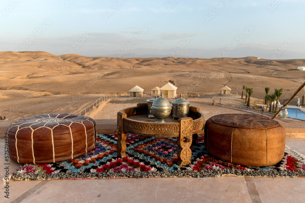 traditional dinner place setting in remote Agafay Desert near Marrakesh Morocco - obrazy, fototapety, plakaty 
