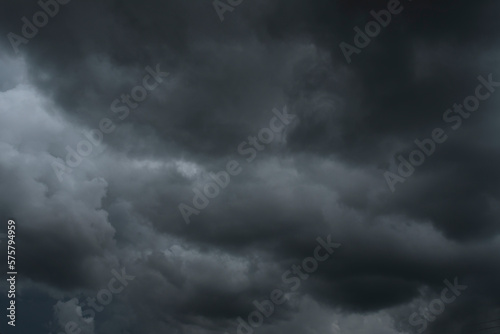 Dramatic dark storm thundercloud rain clouds on black sky background. Dark thunderstorm clouds rainny landscape. Meteorology danger windstorm disaster climate. Dark cloudscape storm disaster gray sky
