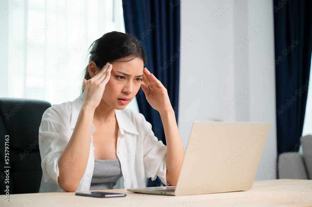 Office syndrome. Overworked tired young asian woman feeling headache, having eyesight problem after computer laptop work. Stressed young woman suffering from fatigue at home Office syndrome. Overworked tired young asian woman feeling headache, having eyesight problem after computer laptop work. Stressed young woman suffering from fatigue at home